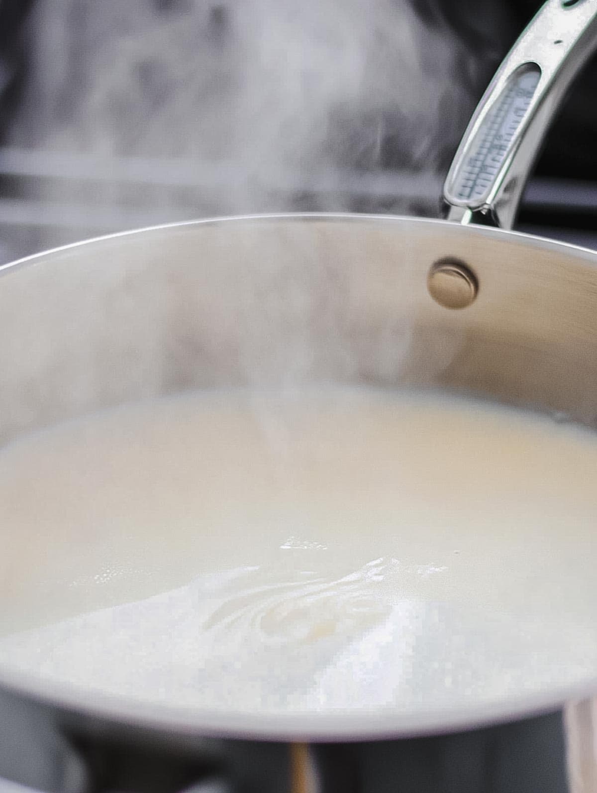 Steam rising from a saucepan on the stove.