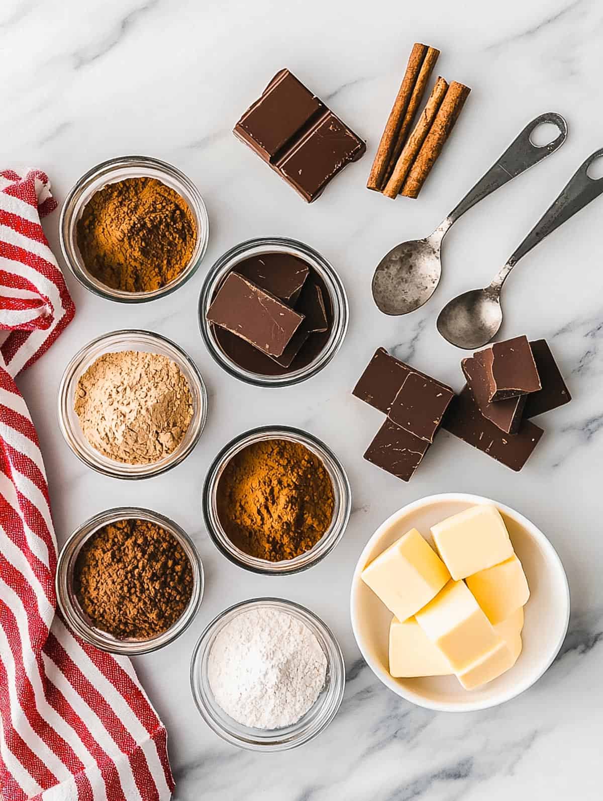 Assorted baking ingredients on a marble countertop.